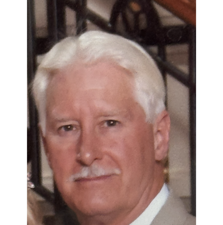 Portrait of an elderly man with white hair and a mustache.